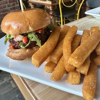 Cajun Burger with side of Chick Pea Fries  at Lola Rosa - Places des Festivals in Montreal