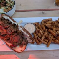 Cheesesteak and fries at Lola Rosa - Places des Festivals in Montreal