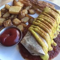 Breakfast burrito with breakfast potatoes and rice bacon  at Lola Rosa - Places des Festivals in Montreal
