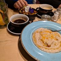 Acai bowl, latte with oat milk, triple shot americano, porridge with jam. at Urbanity in Dublin