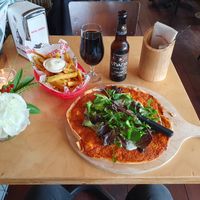 Vegan flahmacun (flammkuchen), portion fries with vegan mayo and O'Hara's Irish Stout. at Credible in Nijmegen