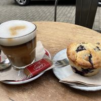 Vegan blueberry muffin, lstte with oat milk at Velo Cafe in Interlaken