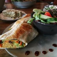 Vegan wrap with vegetables and salad as a side at Velo Cafe in Interlaken