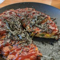 Okonomiyaki tasted like it was reheated from frozen. Had carrots corn and peas inside. at Silk in Split