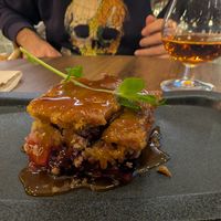 Pear berry crumble with salted caramel sauce. Nice moscatel too! at The Green Affair - Saldanha in Lisbon