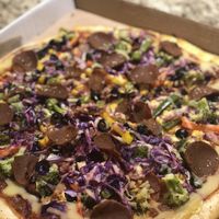 vegan pizza with handmade pepperoni and cheese  at FGF VEGAN - Famous Good Food in Oshawa