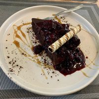 Chocolate cake with berry compote  at Da Vinci Italian Restaurant in Aberdeen