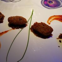 Vegetable patties with caramelized onion mousse and smoked tomato. Divine. at RossoVivo Primaluna in Malcesine