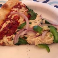 Slice of vegan pizza at Pizza by the Sea in Rosemary Beach