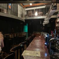 Empty restaurant with one shared menu  at Alf in Haifa