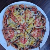 פיצה עם מגוון תוספות עשיר at Alf in Haifa