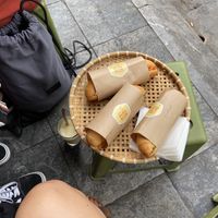 Outdoor setting, eating like a local at Banh Mi 25 in Hanoi