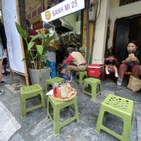 One of the franchises, on the opposite side of the street you had an actual eating area, with tables, where you could also wait for the food at Banh Mi 25 in Hanoi