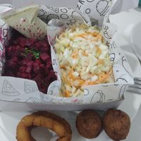 Delivery: beet salad, Cole slaw, falafel and onion rings at Antojos Veganos in Armenia