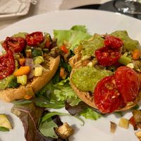 Frisella (Puglian crunchy bread) with vegetables, tomatoes, and pesto.  at Komera in Monopoli