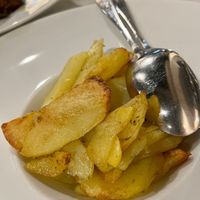 Roasted potatoes with wild herbs.  at Komera in Monopoli