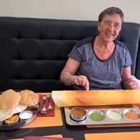 left the South-Indian thali, right with my wife laughing the fine dosa masala with ghee at Krishna Vilas in The Hague