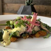 Portabello, pickled onions, green onion and Hollandaise sauce on a delicious savory waffle!! at Grounded in Stratford