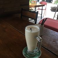 Yummy banana shake on the patio! at Monkey Grounds Coffee in Iloilo City