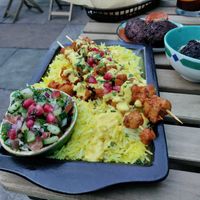 Chikin skewers on delish saffron rice with saffron yogurt. at Koocha Mezze Bar in Bristol