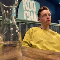 A vegan man in a vegan restaurant  at Koocha Mezze Bar in Bristol