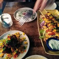 skewers on the right, tzatziki top at Koocha Mezze Bar in Bristol
