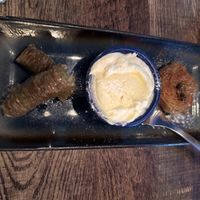 Baklava with whipped cream   at Koocha Mezze Bar in Bristol
