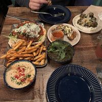 Doner kebab and fries, ghormeh sabzi, oyster mushroom wings, Parmesan sprouts and humous   at Koocha Mezze Bar in Bristol