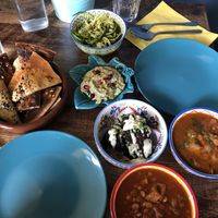 Zattar flatbread (left), courgetti pasta (top), artichoke dip (middle), eggless kookoo, bamieh (right), gaymeh (bottom) at Koocha Mezze Bar in Bristol