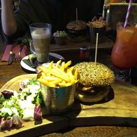 Vegan burger at the back, veggie burger at the front. at The Magic Roundabout in Bowness-on-windermere