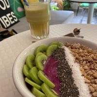Pitaya (dragon fruit) smoothie bowl with granola, coconut and kiwi  at Happy Blender in Athens