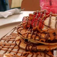 Pancakes, guilty : Peanut buter, banana, vegan nutella, and strawberries at Happy Blender in Athens