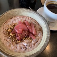 Porridge with poached pear and cherries at Equium Social in Newcastle