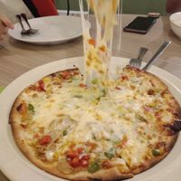 Amazingly stretchy non-dairy cheese on the mushroom pizza. Definitely recommended. at 1st Green Veggie Restaurant in Subang Jaya