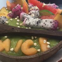 Green bowl : green thin yogurt (smoothie) consistency w/ granola & fresh fruit at Vegan Bowls in Barcelona