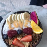 açaí bowl served in coconut at Vegan Bowls in Barcelona