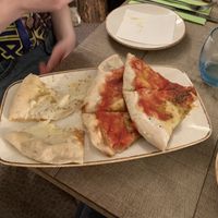 Half tomato half vegan mozzarella garlic bread - gorgeous  at Ego Mediterranean in Preston