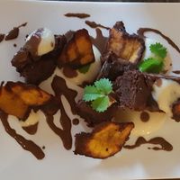 Banane plantain brownie,  banane plantain siphon, almond milk and chocolate sauce at Table Metis in Paris