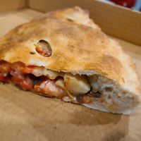 Calzone - tomatoes, artichoke & olives at Troy's Italian Kitchen in Arlington