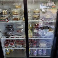 Fridge with vegan cakes and cheesecakes at Troy's Italian Kitchen in Arlington