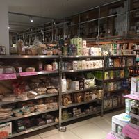 The front of the shop shows wide selection of breads (inc gluten-free), flours and plant milks at Earth Natural Foods in North West London
