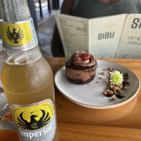Cake for him, cerveza for me. Outdoor seating available.   at Sibu Cafe in Uvita