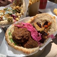 The falafel added to a veggie pita and seasoned fries. 😋 at Brassica in Bexley