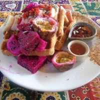 Vegan waffles smothered in fruit! at Blossom Cafe in Pai
