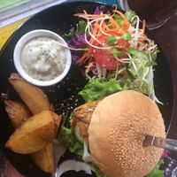 Tempeh burger comes with big potato wedges and delicious aioli (all vegan) (I hate aioli but loved this one😄 at Blossom Cafe in Pai