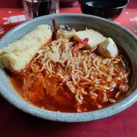 Spicy tangy on the tongue noodles with mock fish balls at Rumah Juliet in Jakarta