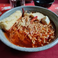 Spicy tangy on the tongue noodles with mock fish balls at Rumah Juliet in Jakarta