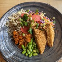 Boo-fu bowl (sesame coated tofu, brown rice, edamame, kimchi, slaw, satay) at Boo's Kitchen in Mumbles