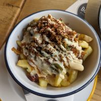 Dirty fries (chips, cheese or vegan cheese, fried onion, jalapeños, beans, sauce) at Boo's Kitchen in Mumbles