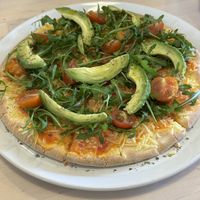 Pizza with avocado (gf option)   at Roots Cafe in Cascais